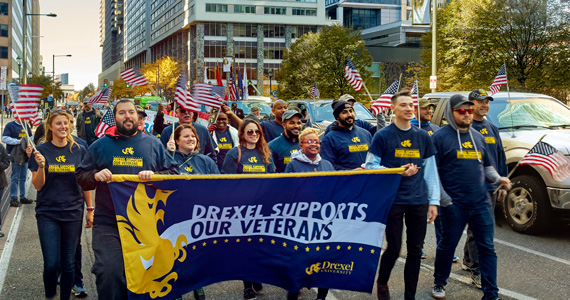 veterans marching with flag